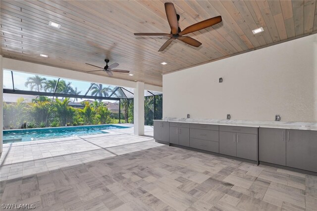 interior space with ceiling fan