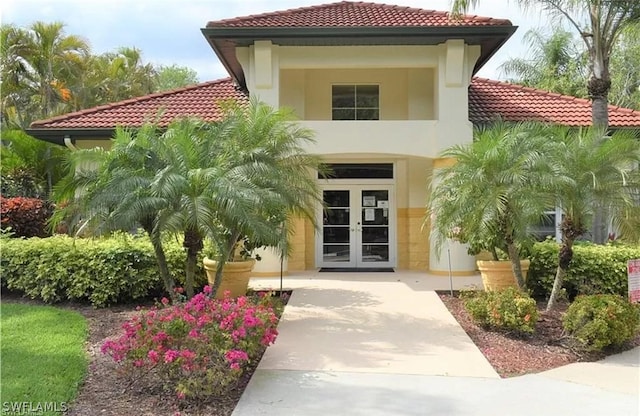 property entrance featuring french doors