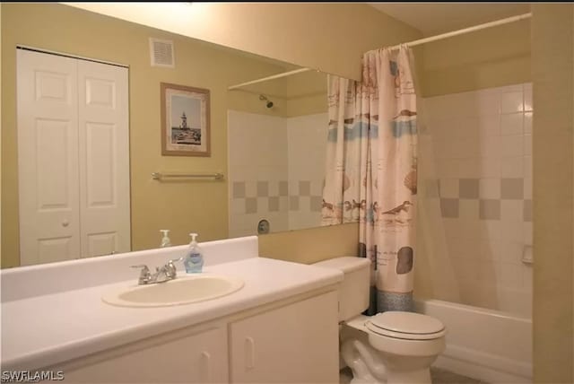 full bathroom with vanity with extensive cabinet space, toilet, and shower / tub combo