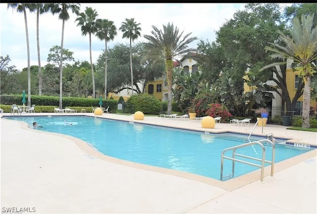 view of swimming pool with a patio