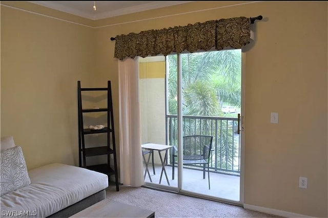 carpeted bedroom featuring crown molding, multiple windows, and access to exterior