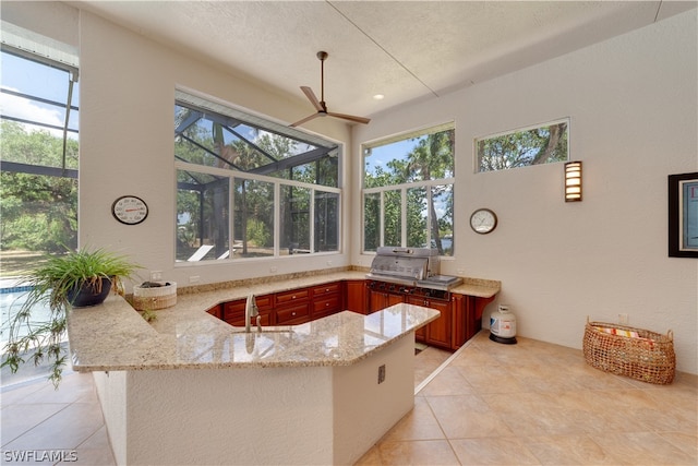 bathroom with plenty of natural light and tile floors