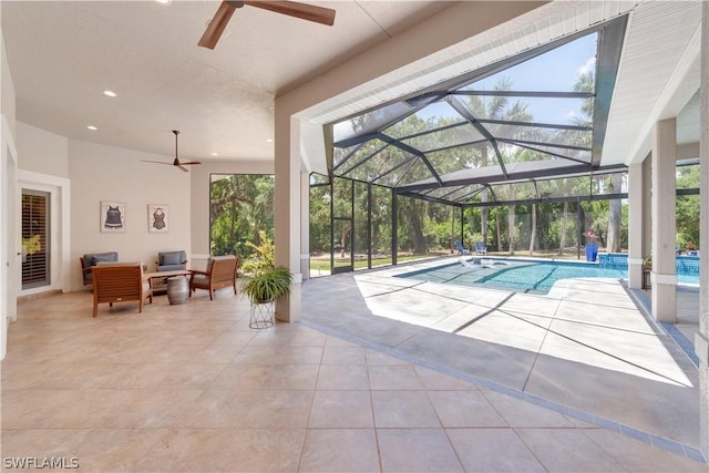 pool with glass enclosure, a patio, and outdoor lounge area