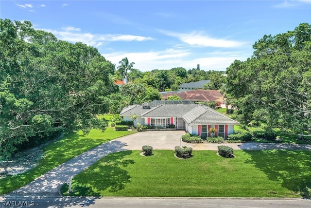 ranch-style home featuring a front yard