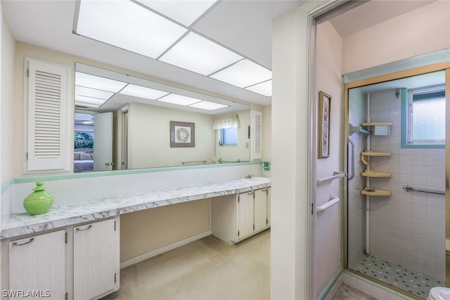 bathroom featuring vanity and walk in shower