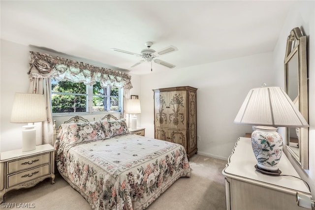 bedroom with ceiling fan and light colored carpet