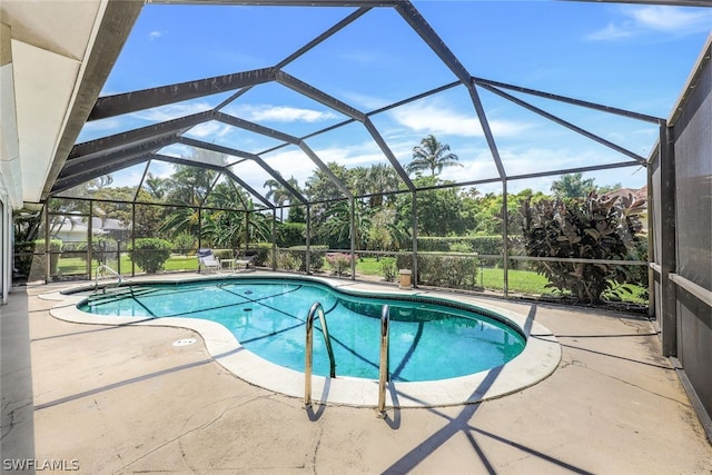 view of swimming pool featuring glass enclosure and a patio