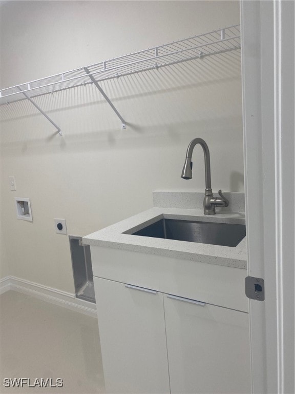 laundry area featuring sink, washer hookup, and hookup for an electric dryer