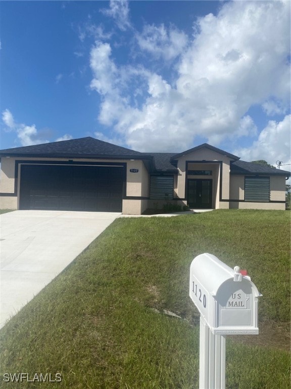 single story home with a garage and a front yard