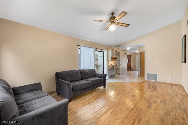 living room with ceiling fan and light wood-type flooring