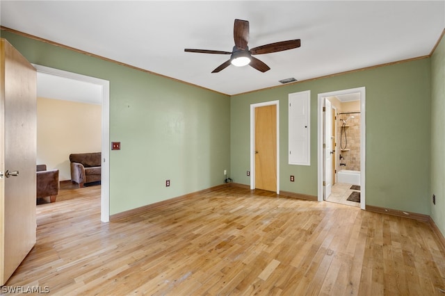 unfurnished bedroom featuring light wood-type flooring, connected bathroom, and ceiling fan