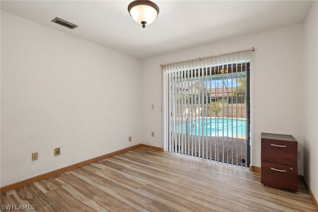 empty room with light wood-type flooring