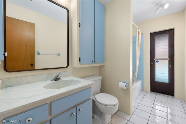 full bathroom featuring shower / bath combination with curtain, vanity with extensive cabinet space, tile floors, and toilet