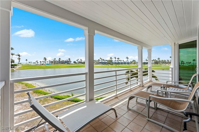 balcony featuring a water view