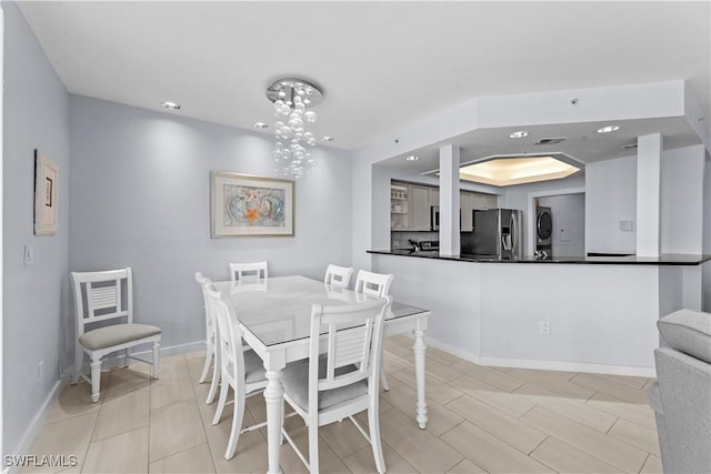 dining area with stacked washer / drying machine