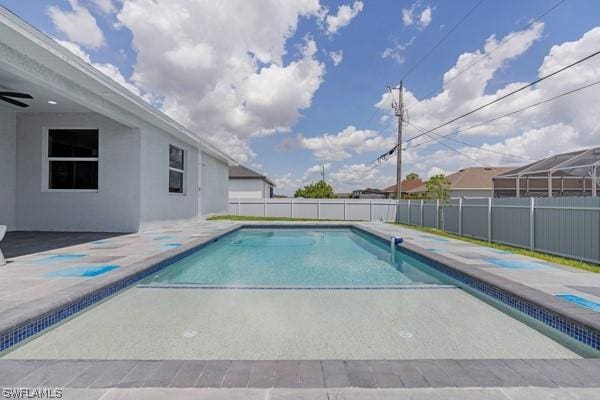 view of pool featuring a ceiling fan, a fenced in pool, a patio area, and fence