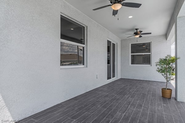 exterior space featuring ceiling fan