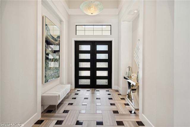 foyer entrance featuring a high ceiling