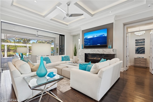 living room with ceiling fan, ornamental molding, coffered ceiling, and dark hardwood / wood-style flooring