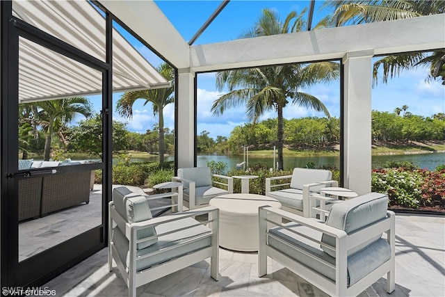 sunroom / solarium featuring a water view and lofted ceiling