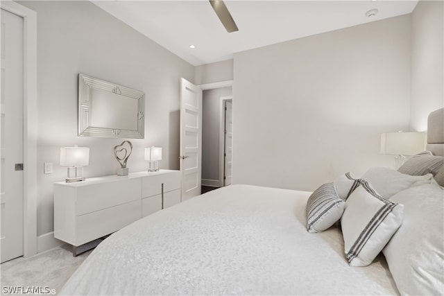 bedroom featuring ceiling fan and light colored carpet