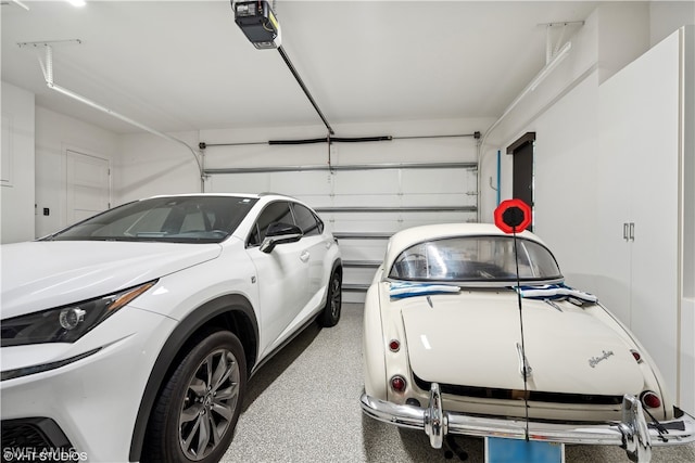 garage featuring a garage door opener