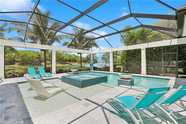 view of pool with an in ground hot tub, a lanai, and a patio