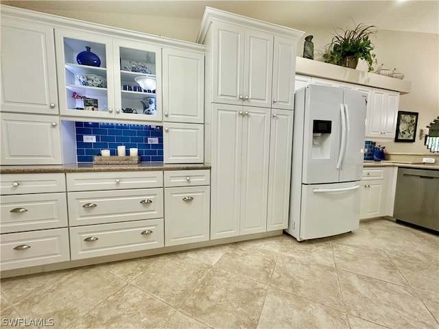 kitchen with backsplash, light tile patterned floors, white fridge with ice dispenser, white cabinets, and dishwasher