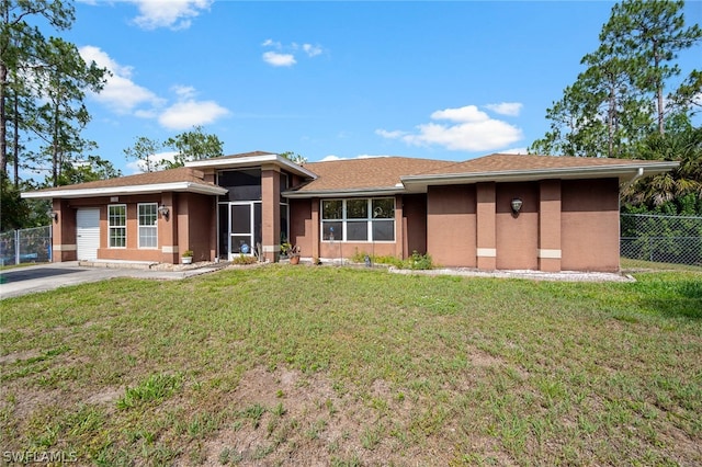 prairie-style house with a front lawn