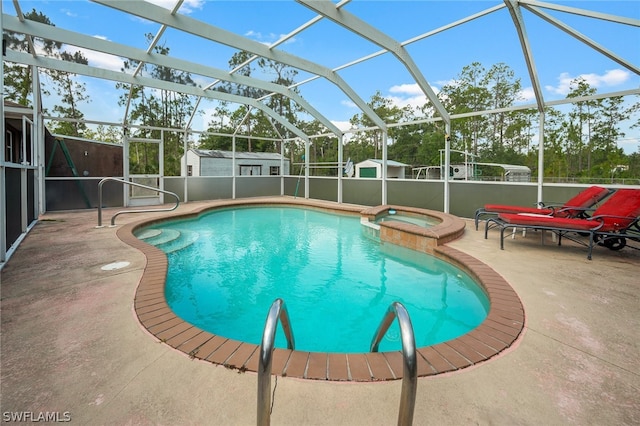 view of pool featuring a lanai, an in ground hot tub, and a patio