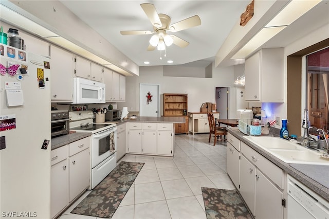 kitchen featuring ceiling fan, kitchen peninsula, white appliances, light tile floors, and white cabinets