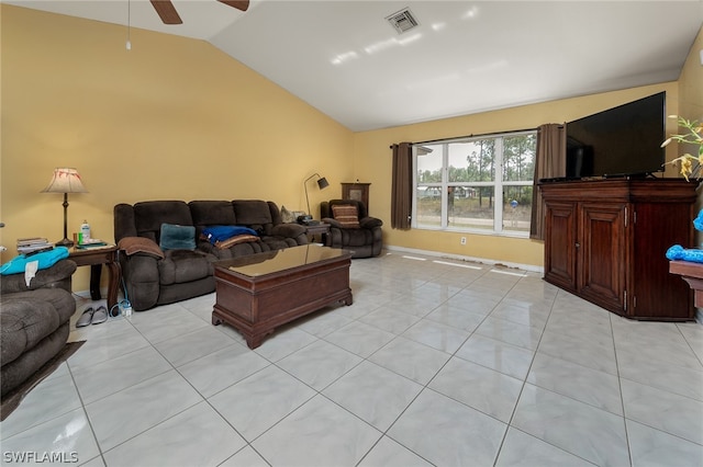 living room featuring light tile floors, ceiling fan, and vaulted ceiling