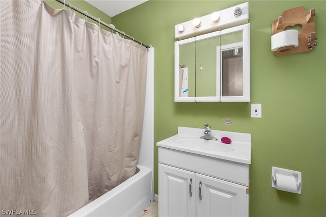 bathroom featuring shower / tub combo and large vanity