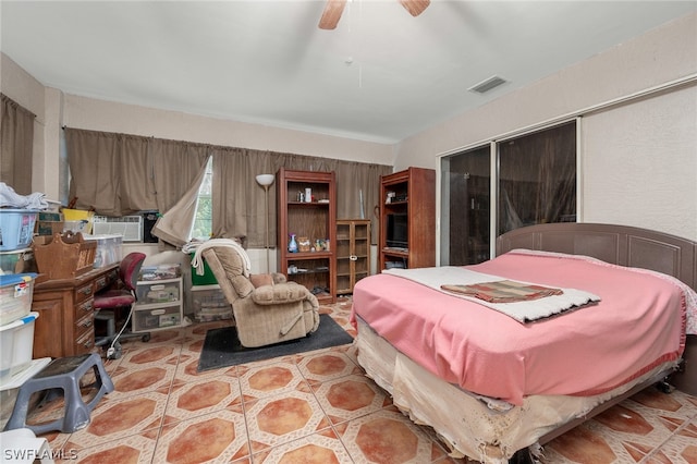 bedroom featuring light tile flooring and ceiling fan