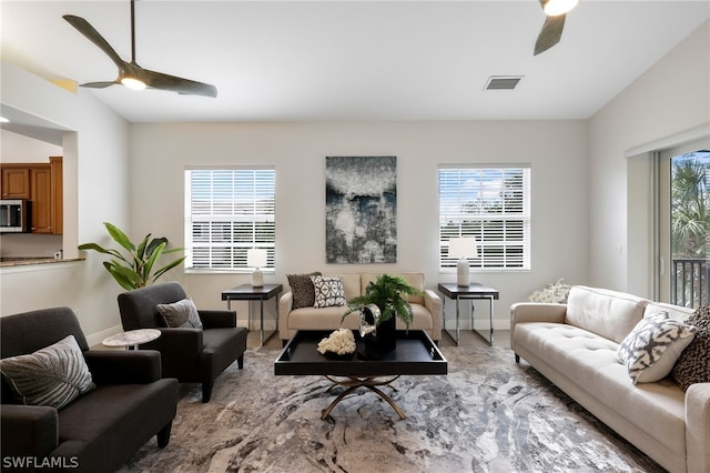 living room featuring a healthy amount of sunlight and lofted ceiling