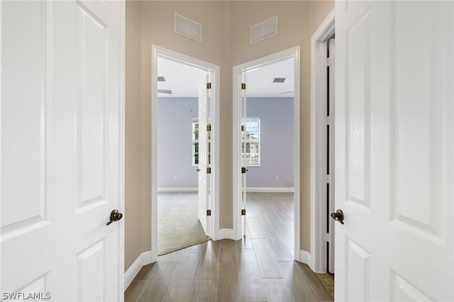 hallway featuring hardwood / wood-style floors