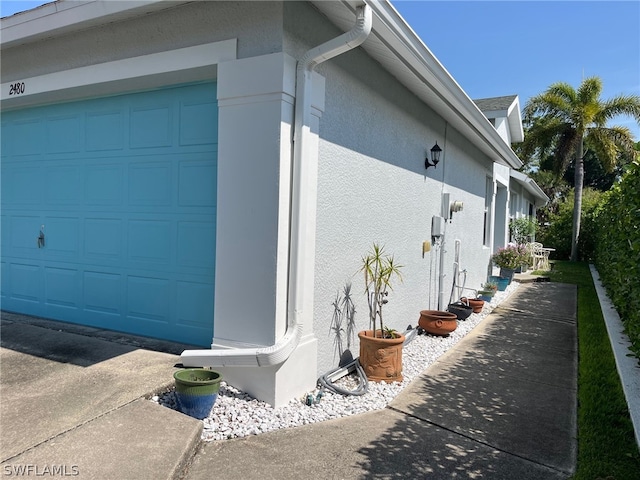 view of side of home with a garage