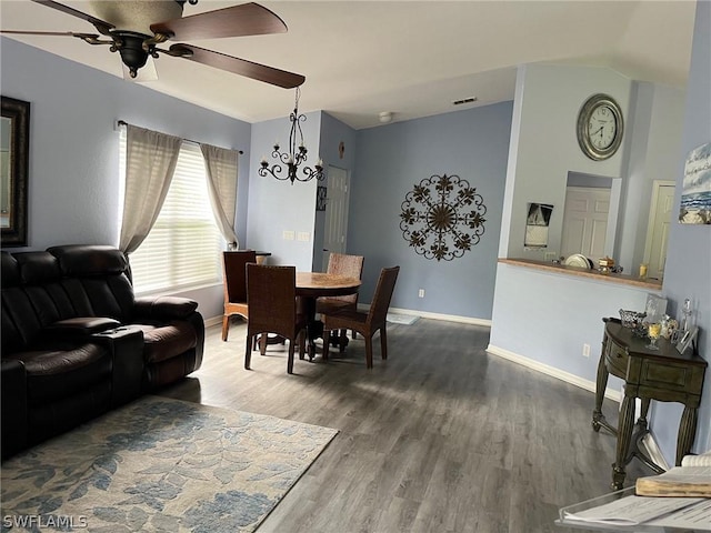 2480 Lake Ave, Naples, FL 34112 - dining area featuring a ceiling fan, baseboards, wood finished floors, a chandelier, and lofted ceiling