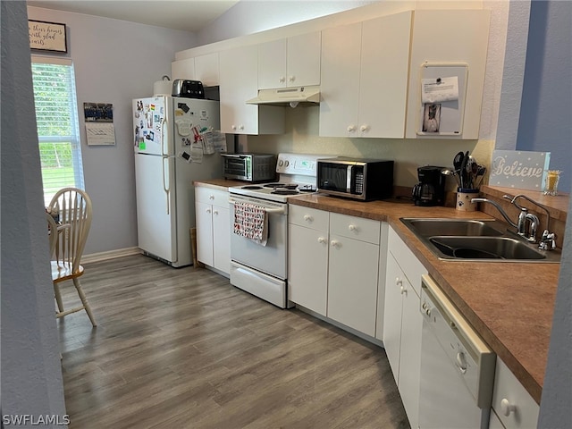 kitchen featuring sink, white appliances, white cabinetry, and wood-type flooring