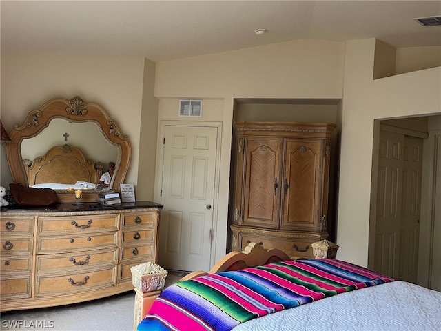 carpeted bedroom featuring vaulted ceiling