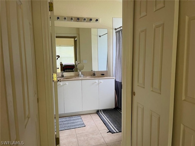 2480 Lake Ave, Naples, FL 34112 - full bathroom with tile patterned floors, vanity, and a shower with curtain