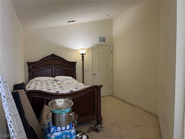 carpeted bedroom featuring vaulted ceiling