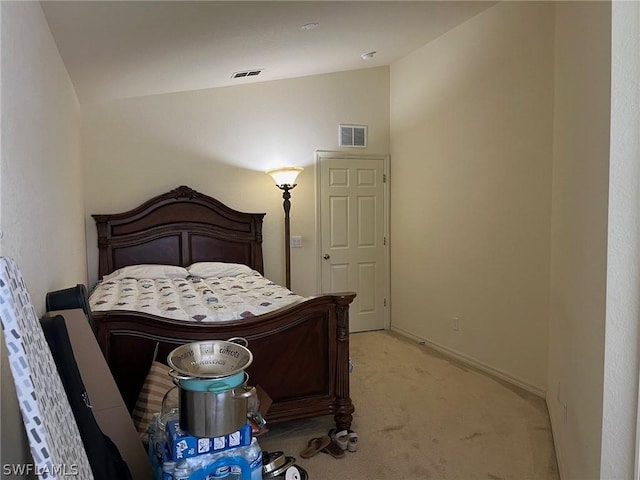 2480 Lake Ave, Naples, FL 34112 - bedroom with vaulted ceiling, light colored carpet, and baseboards