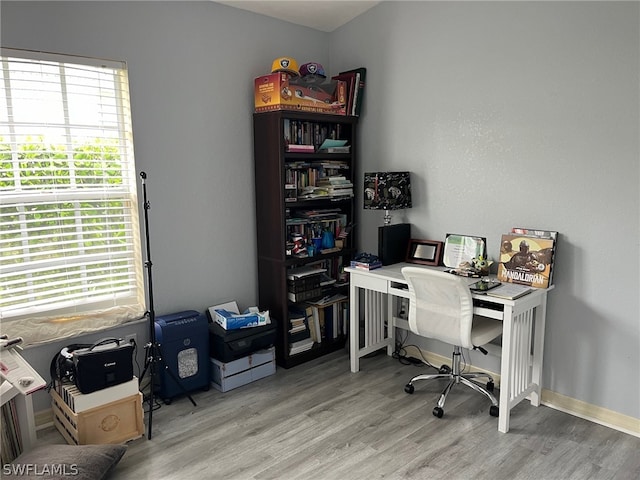 office space with light wood-type flooring