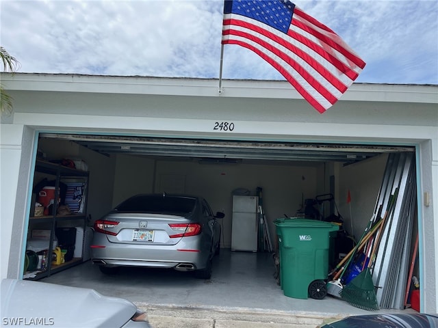 garage with white refrigerator