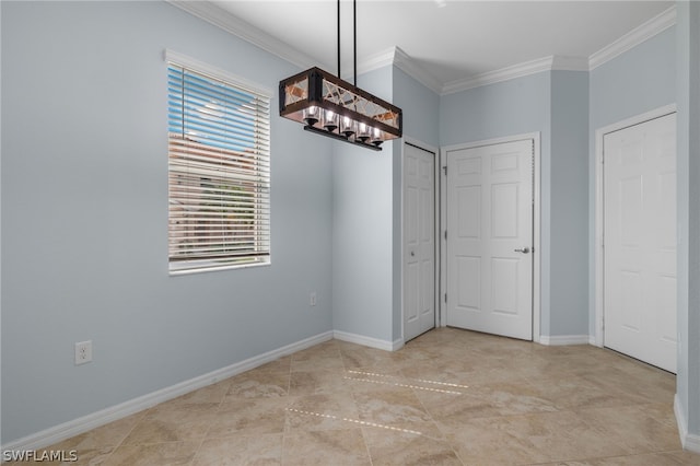 interior space featuring crown molding and a notable chandelier