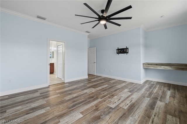 spare room with hardwood / wood-style flooring, ceiling fan, and ornamental molding