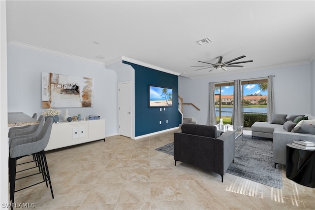 living room featuring ceiling fan and ornamental molding