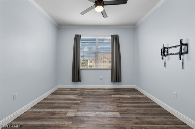 spare room with crown molding, ceiling fan, and dark wood-type flooring