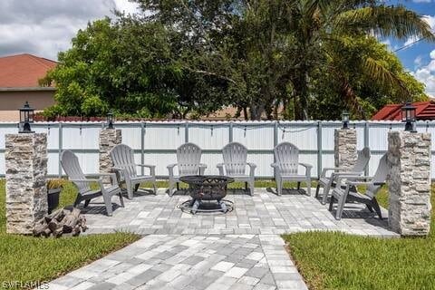 view of patio featuring an outdoor fire pit